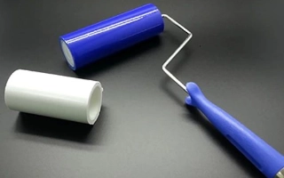 Peelable sheet tacky rollers for cleanroom particle removal from surfaces